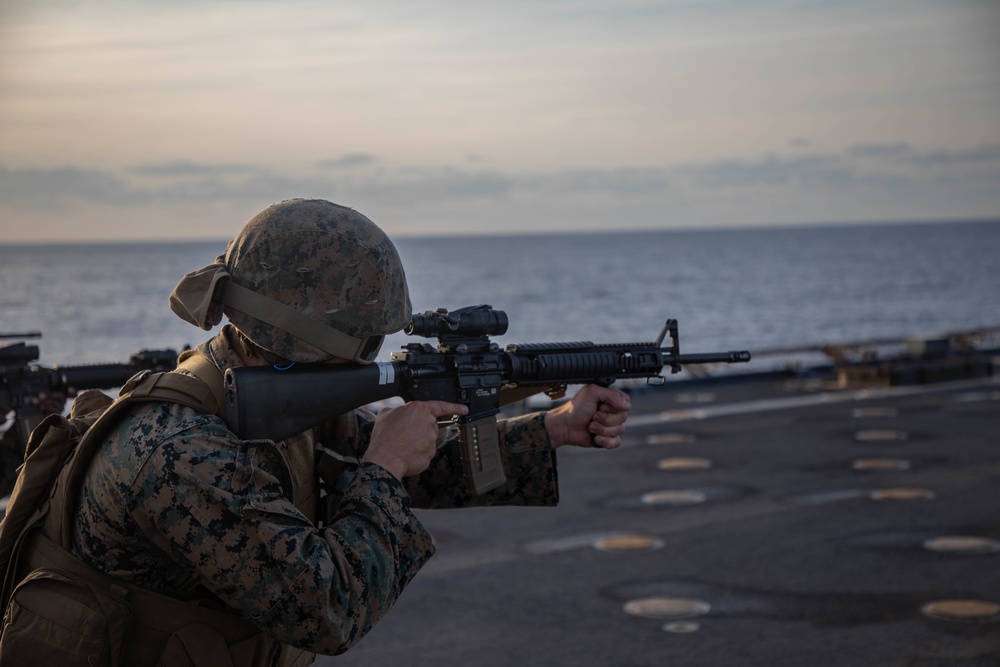 U.S. Marines conduct a range while underway aboard the USS Carter Hall