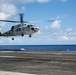 Japan Maritime Self-Defense Force SH-60K Seahawk helicopter lands aboard USS Abraham Lincoln