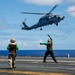 Royal Australian Navy MH-60R Seahawk helicopter lands aboard USS Abraham Lincoln
