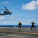 Royal Australian Navy MH-60R Seahawk helicopter lands aboard USS Abraham Lincoln