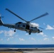 Royal Australian Navy MH-60R Seahawk helicopter lands aboard USS Abraham Lincoln