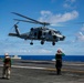Royal Australian Navy MH-60R Seahawk helicopter lands aboard USS Abraham Lincoln