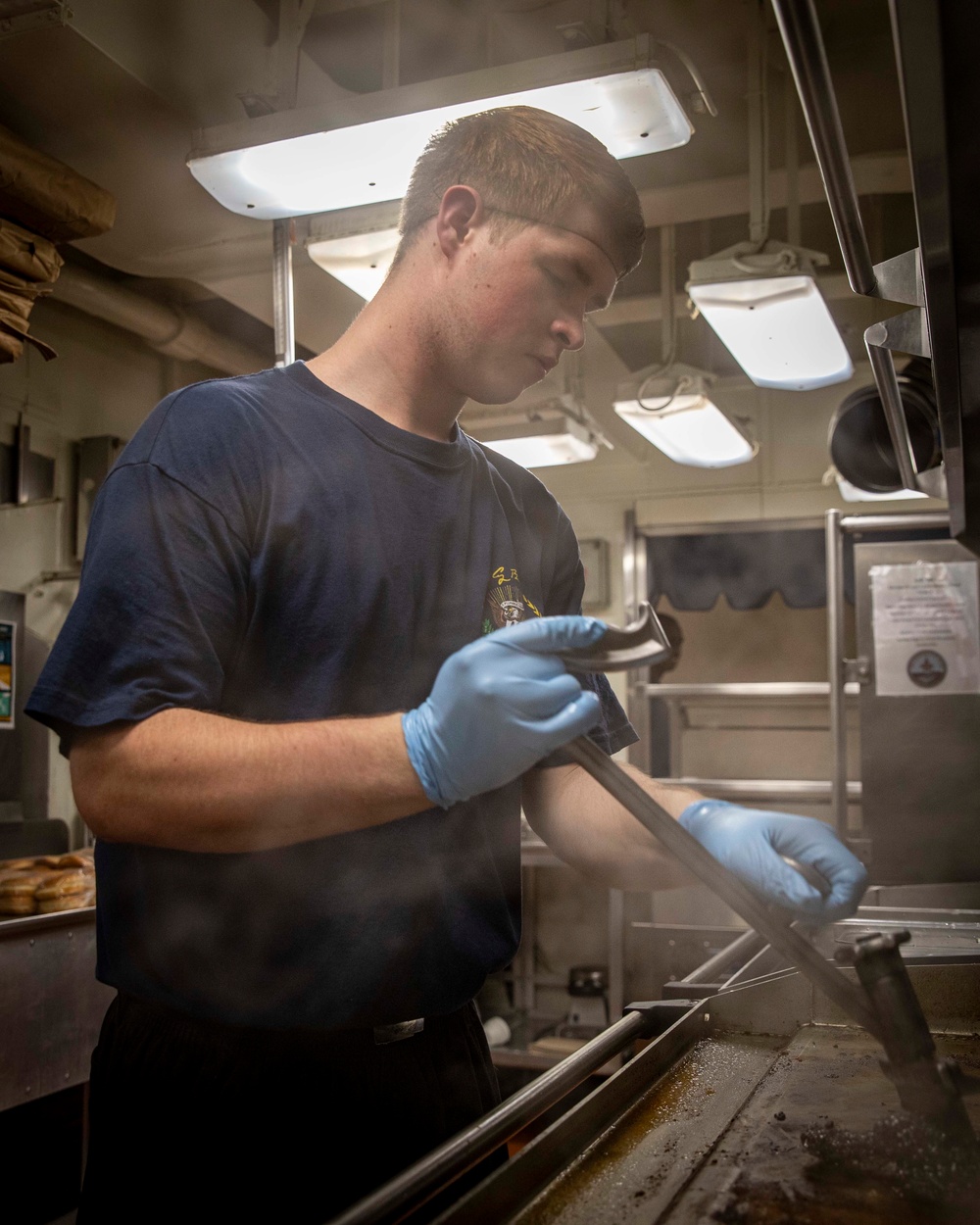 USS George H.W. Bush (CVN 77) Culinary Specialist Works in the Galley