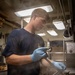 USS George H.W. Bush (CVN 77) Culinary Specialist Works in the Galley