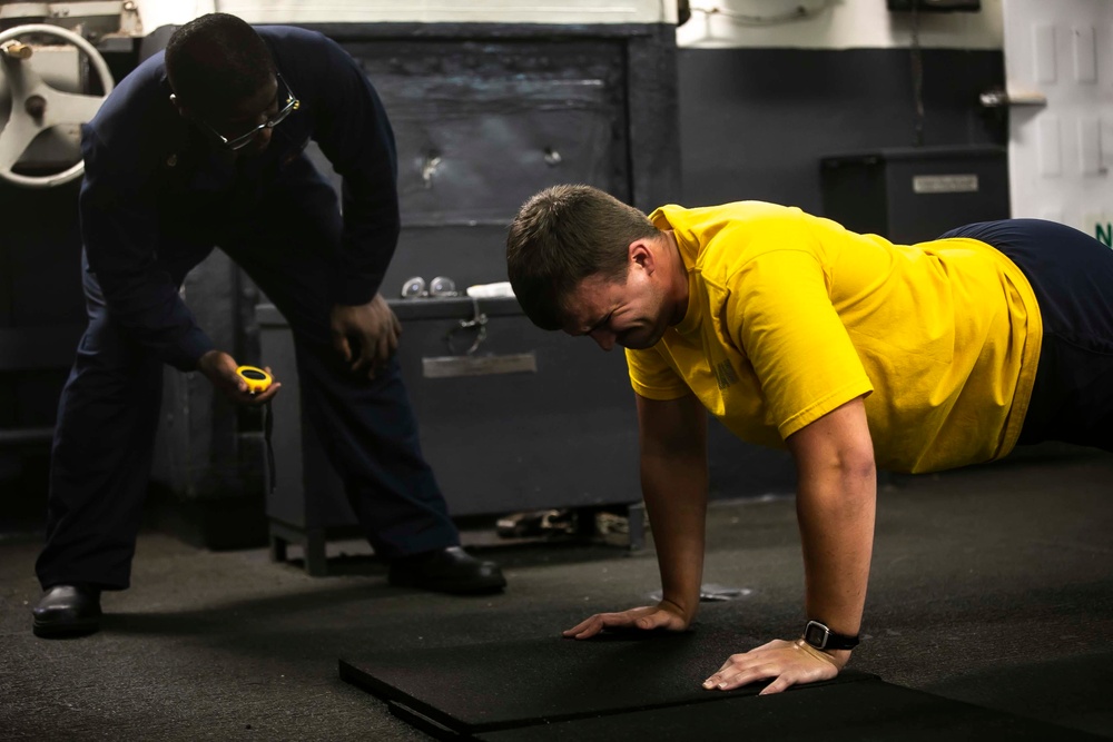 USS George H.W. Bush (CVN 77) Sailor Participates in a Physical Fitness Assessment (PFA)