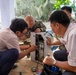 Pacific Partnership and Vietnamese Medical Technicians work on Medical Equipment