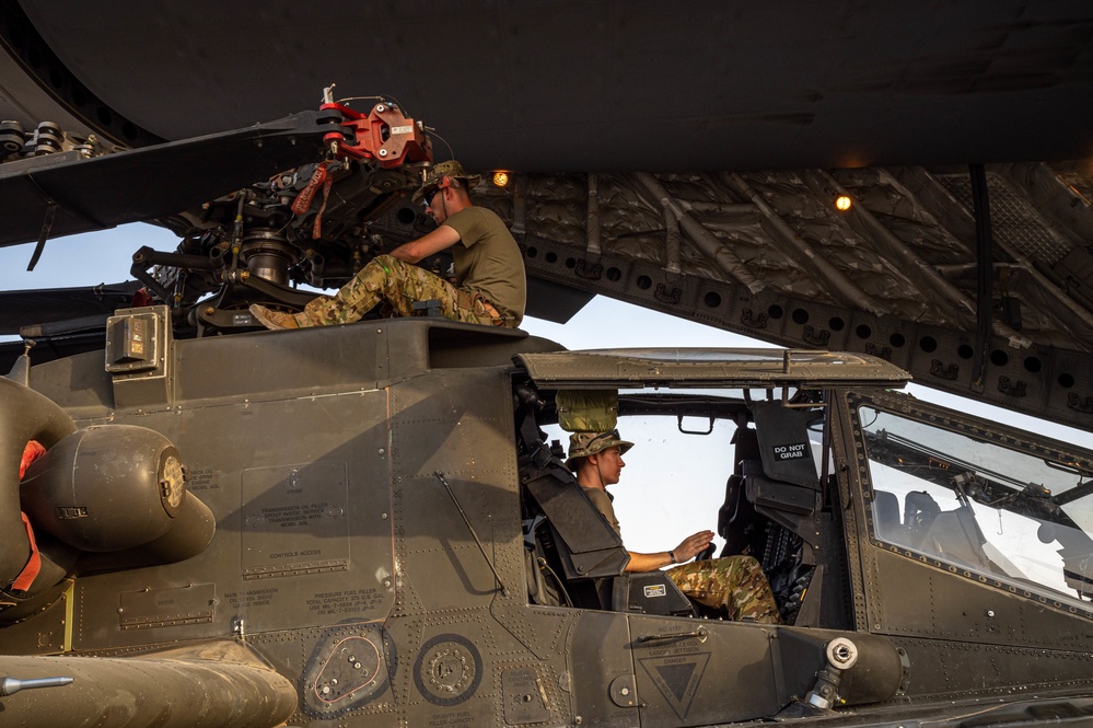 U.S. Air Force and Army conduct movement of Apache helicopters