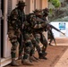 Senegalese Armed Forces soldiers move in formation to breach and clear a room during African Lion 22 in Dodji, Senegal