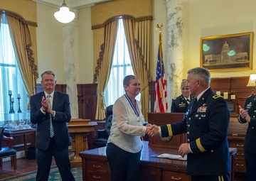 Michelle Hartley presented awards at retirement