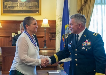 Michelle Hartley presented awards at retirement