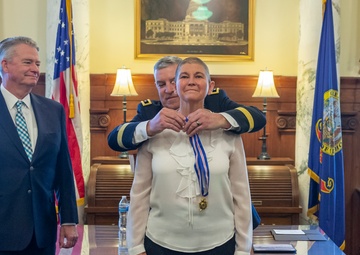 Michelle Hartley presented awards at retirement