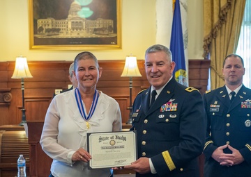 Michelle Hartley presented awards at retirement