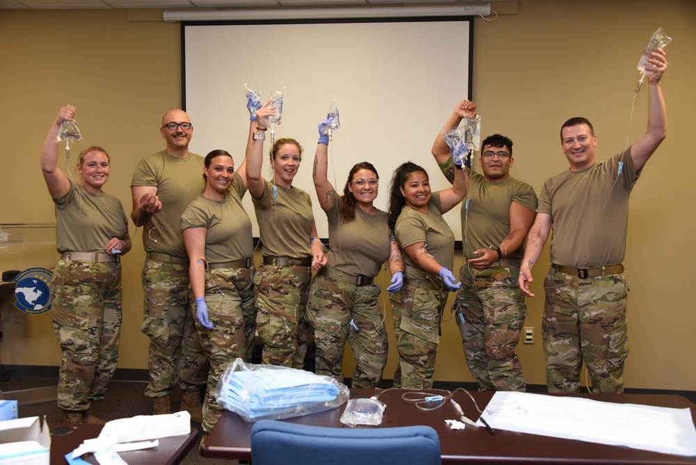 Airmen pose with their IVs