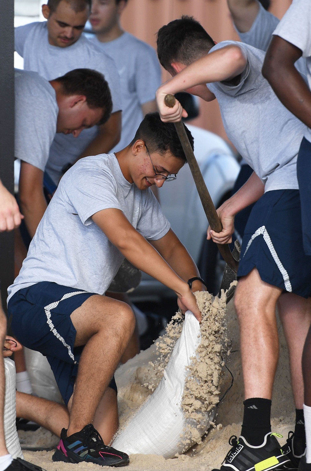 Airmen prepare sand bags for hurricane season