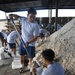 Airmen prepare sand bags for hurricane season