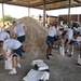 Airmen prepare sand bags for hurricane season