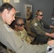 Maj Moore sitting in boom seat on KC-46
