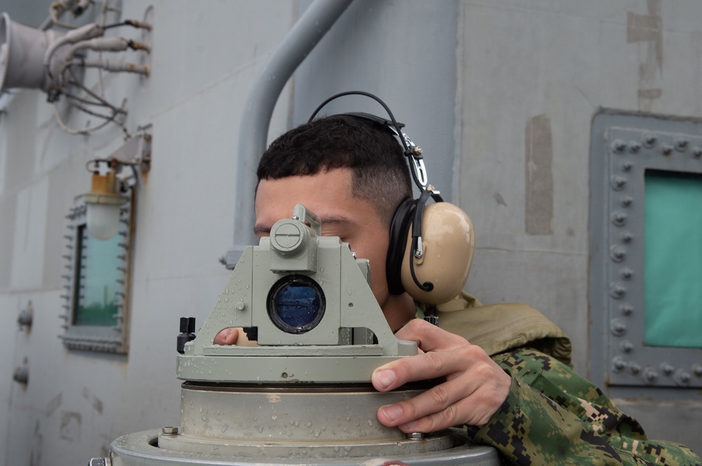 USS Ronald Reagan (CVN 76) pulls out of Naval Base Guam