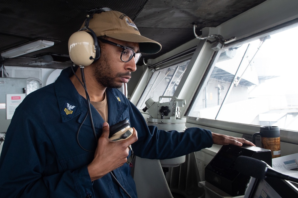 USS Ronald Reagan (CVN 76) pulls out of Naval Base Guam