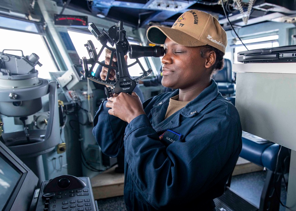 USS George H.W. Bush (CVN 77) Sailor Operates Sextant