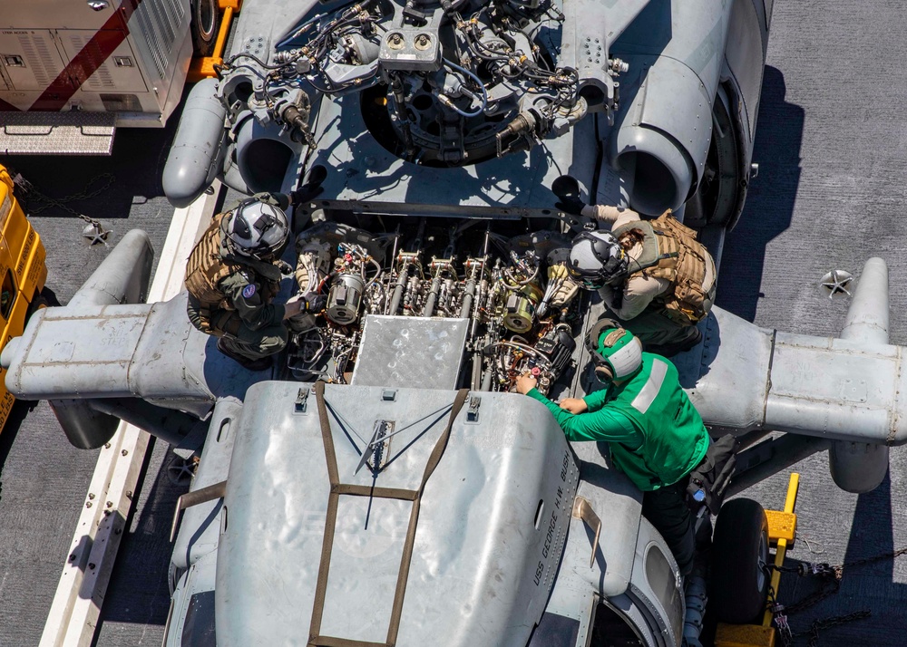 Helicopter Sea Combat Squadron (HSC) 5 Sailors Conduct Maintenance on MH-60R Sea Hawk Helicopter Aboard USS George H.W. Bush (CVN 77)