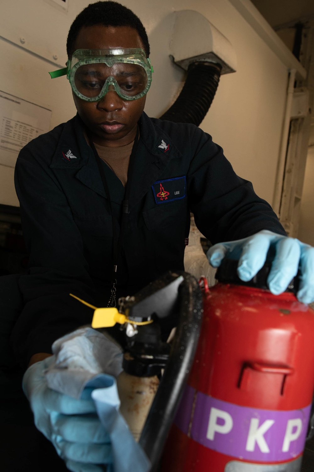 USS George H.W. Bush (CVN 77) Sailor Performs Maintenance