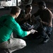 Strike Fighter Squadron (VFA) 136 Sailors Chain an Aircraft Aboard USS George H.W. Bush (CVN 77)