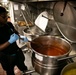 USS George H.W. Bush (CVN 77) Sailor Prepares Food