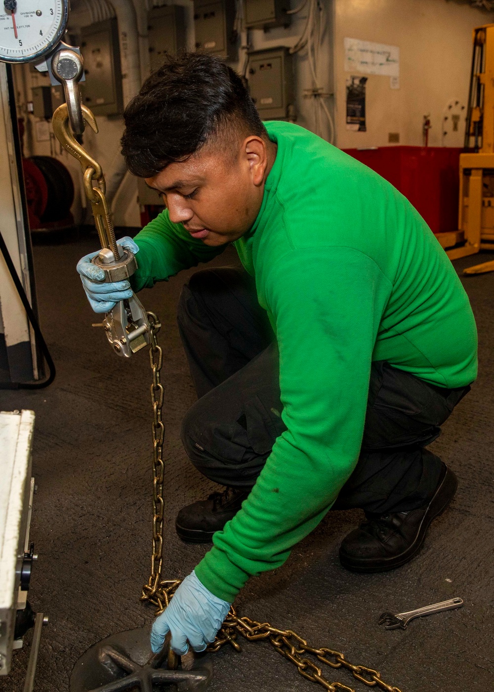 USS George H.W. Bush (CVN 77) Sailor Secures Bomb Hoist