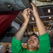 Strike Fighter Squadron (VFA) 136 Sailor Conducts Maintenance on a F/A-18E Super Hornet Aircraft Aboard USS George H.W. Bush (CVN 77)