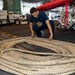 USS George H.W. Bush (CVN 77) Sailor Prepares Line for Storage