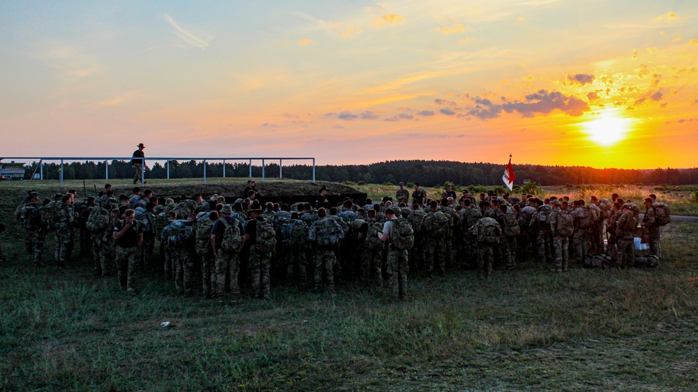 Spur Candidates Conduct a Ruck March During a Spur Ride