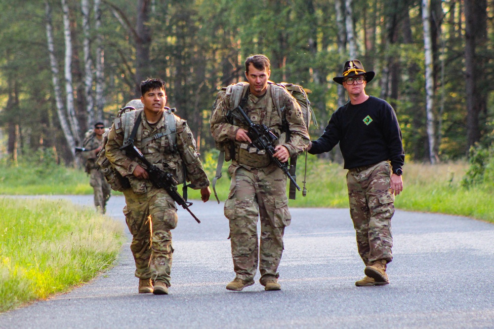 Spur Candidates Conduct a Ruck March During a Spur Ride