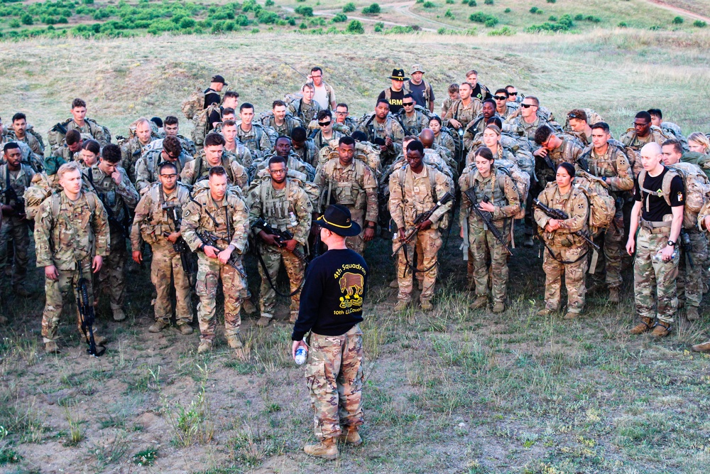 Spur Candidates Conduct a Ruck March During a Spur Ride