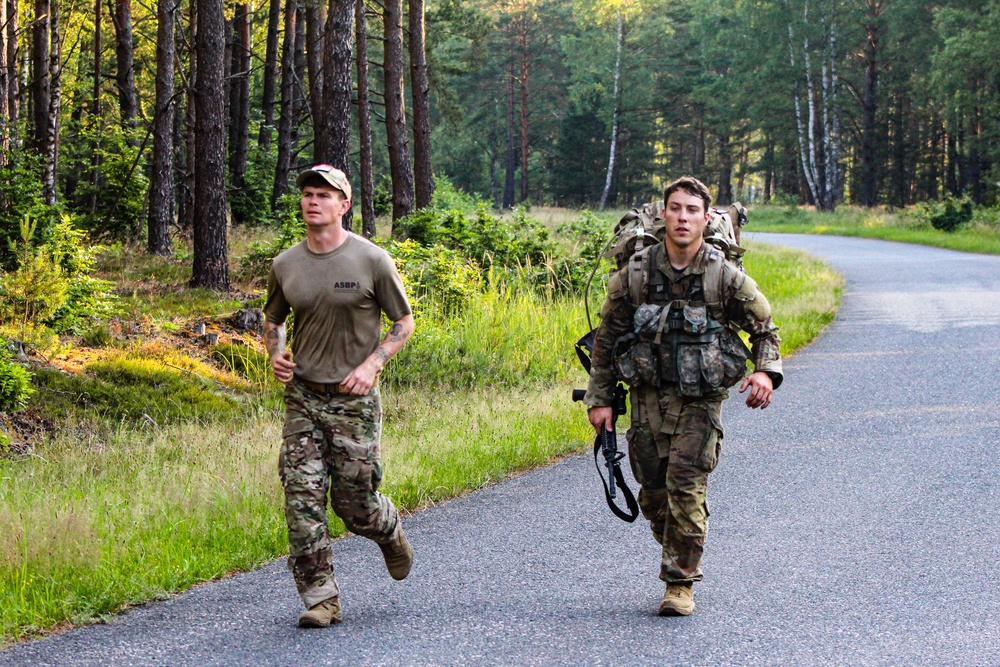 Spur Candidates Conduct a Ruck March During a Spur Ride