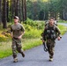 Spur Candidates Conduct a Ruck March During a Spur Ride