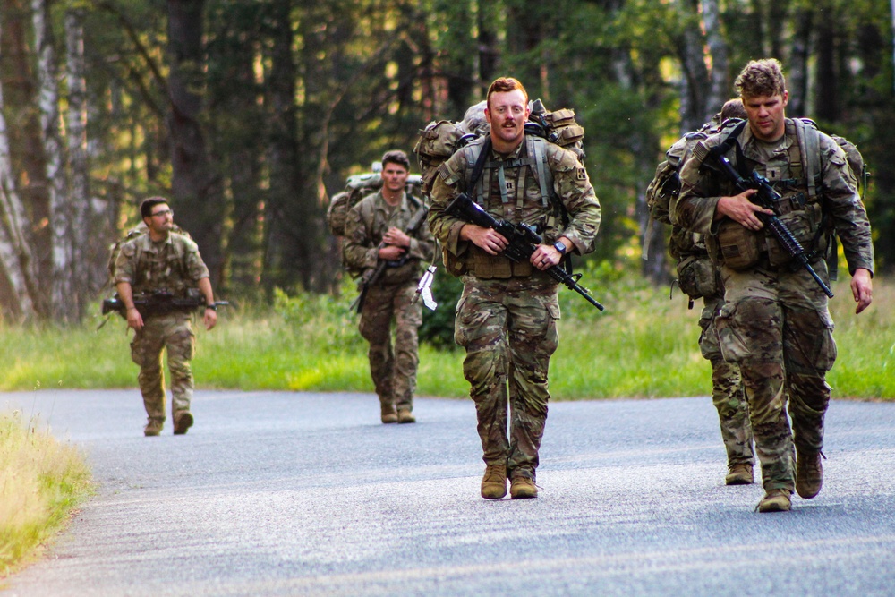 Spur Candidates Conduct a Ruck March During a Spur Ride