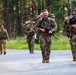 Spur Candidates Conduct a Ruck March During a Spur Ride