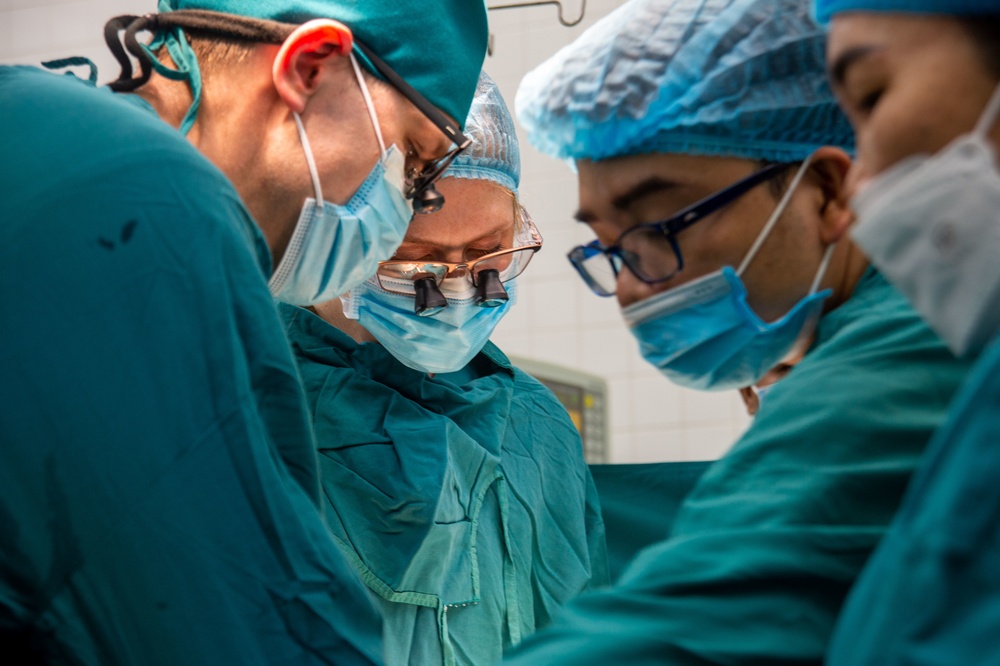 U.S. Navy and Vietnamese Doctors Operate on a Vietnamese Child