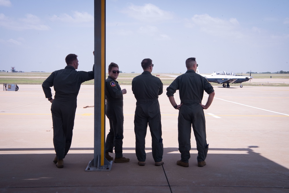 Student pilots take in the views on the flightline.