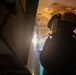 Contractor welds overhead aboard the USS John C. Stennis