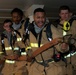 Sailors simulate fighting a fire