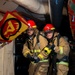 Sailors simulate fighting a fire