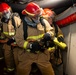 Sailors simulate fighting a fire