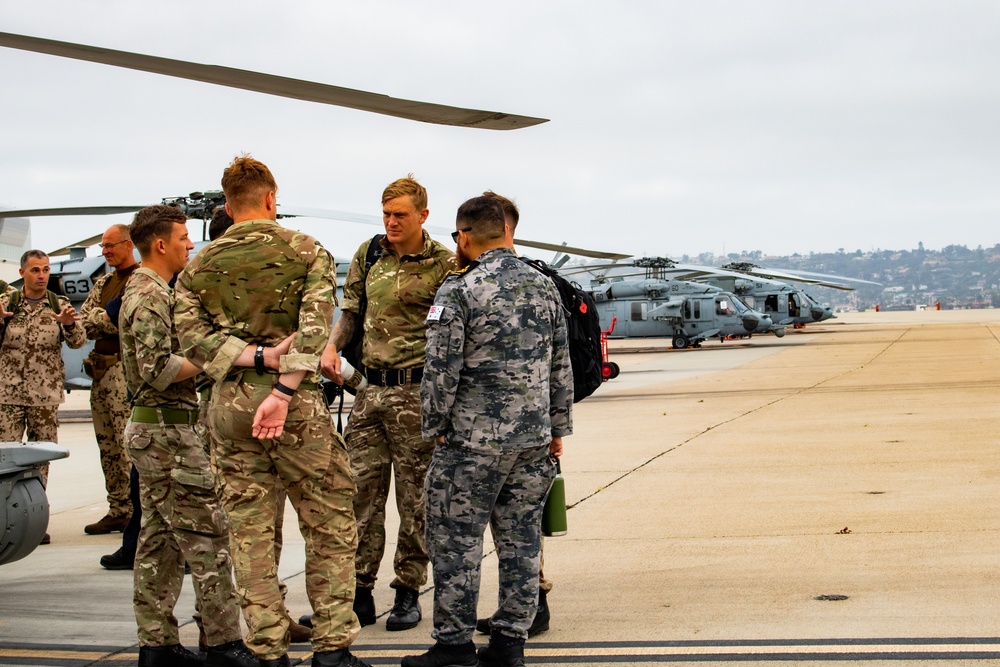 International Service Members Tour MH-60S Seahawk during RIMPAC 2022 SOCAL