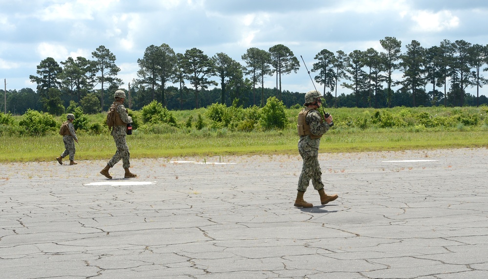 Damage Assessement Team Performs a Walkdown of the Runway