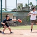 A USS Sampson Sailor and a JS Izumo Sailors play softball