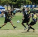 U.S. Sailors face off during soccer game