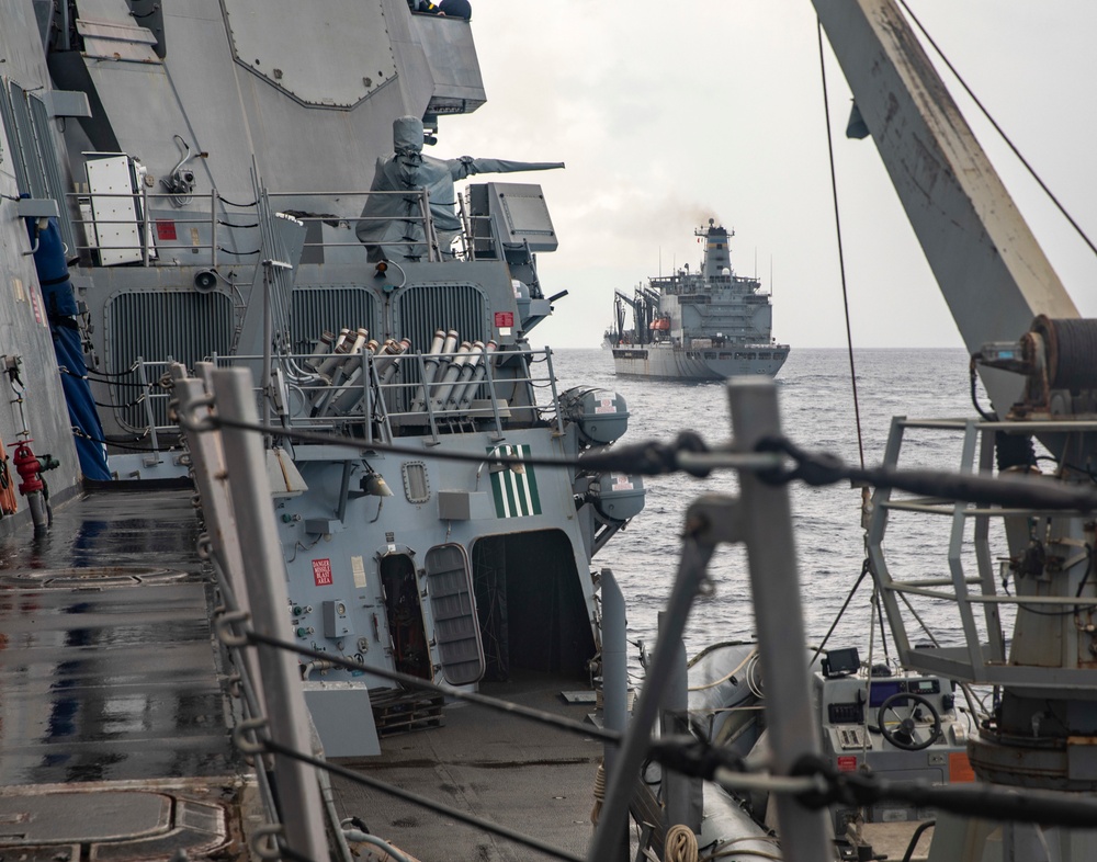 Sailors Aboard USS Dewey (DDG 105) Conduct Replenishment-at-Sea with USNS Tippecanoe (T-AO 199)