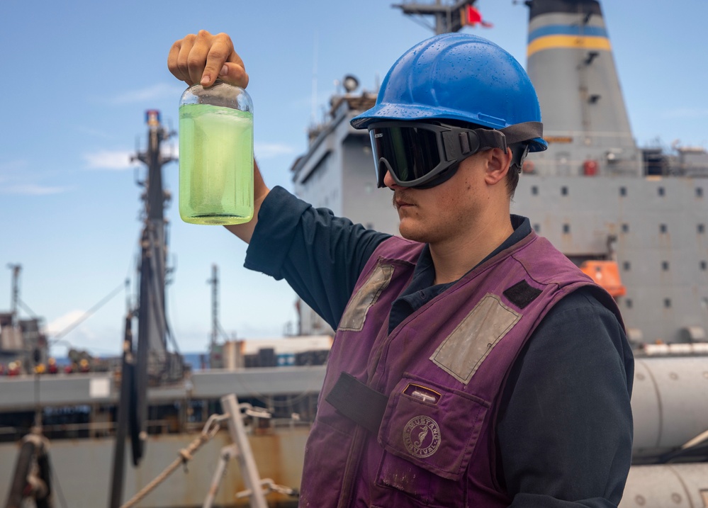 Sailors Aboard USS Dewey (DDG 105) Conduct Replenishment-at-Sea with USNS Tippecanoe (T-AO 199)